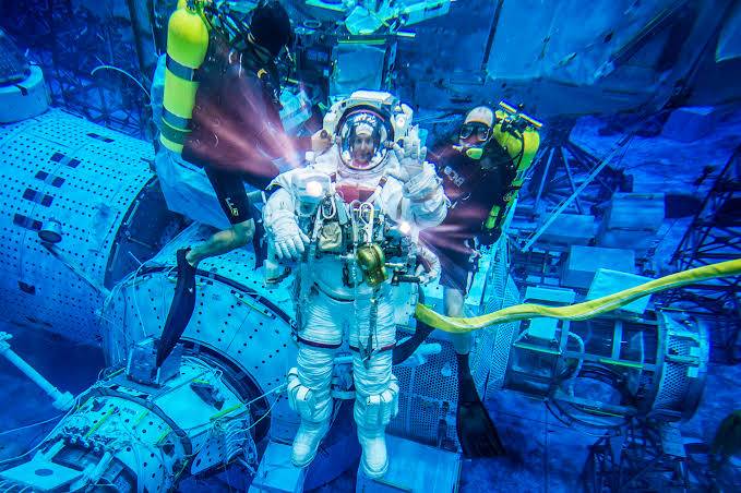 Why do astronauts train underwater?