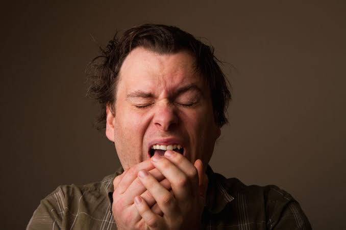 Why do our eyes close when we sneeze?