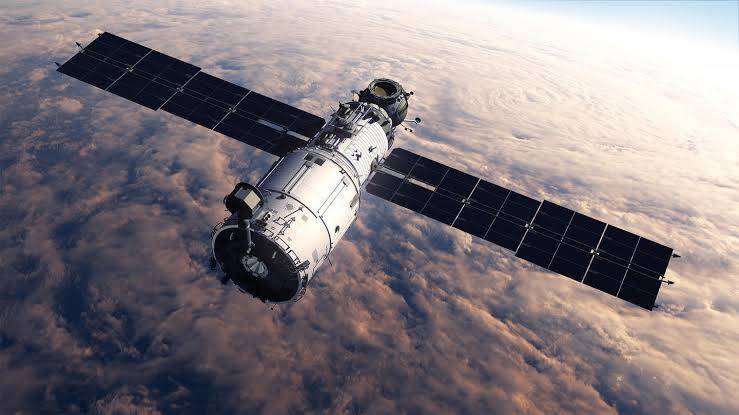 How do satellites stay in orbit?