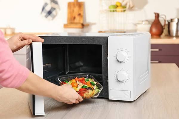 How does a microwave heat food?