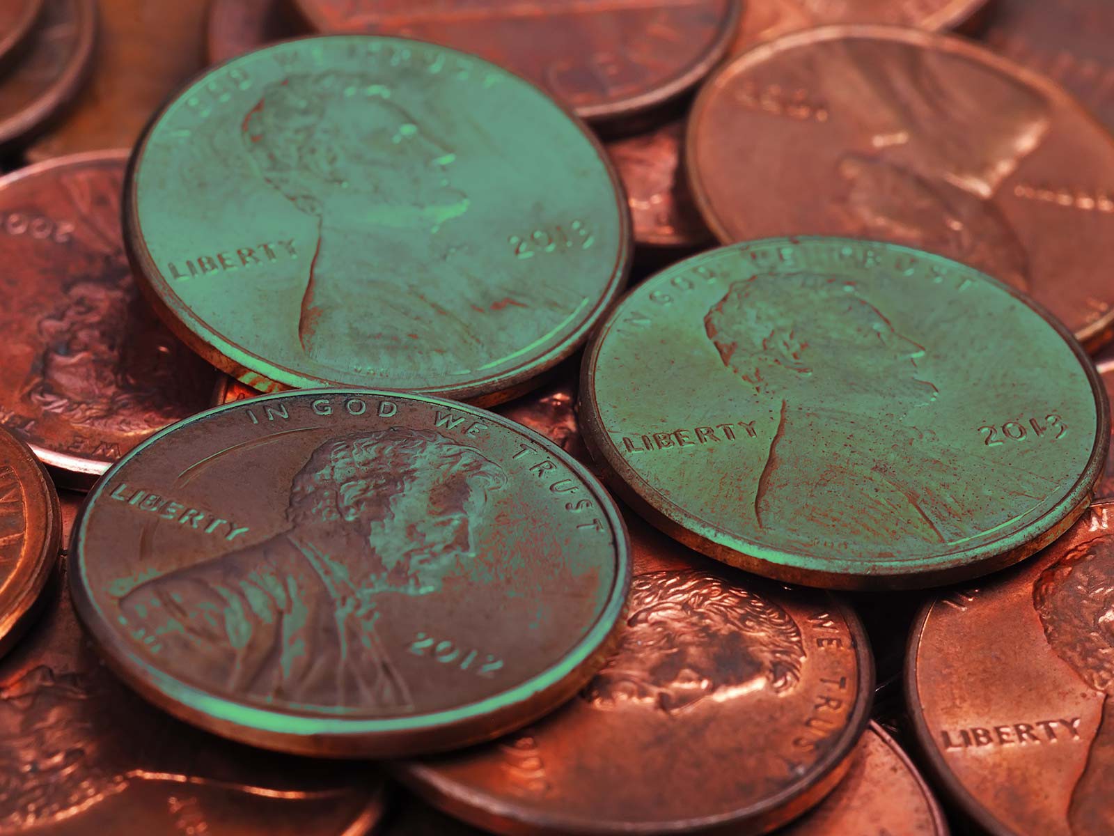 Why do coins turn green over time?